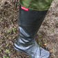 Pokeboo TREAD boots worn on wet grass on woodland ground